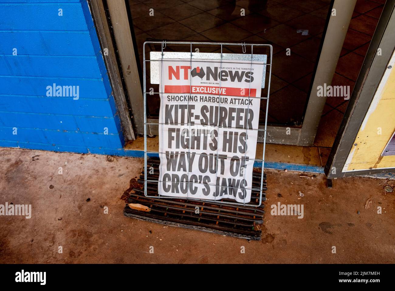 Typical newspaper banner headline for the crocodile obsessed Northern Territory tabloid newspaper the NT Times, known for its pre-occupation with crocodile stories; 'Kite-Surfer Fights His Way out of Croc's Jaws' Stock Photo