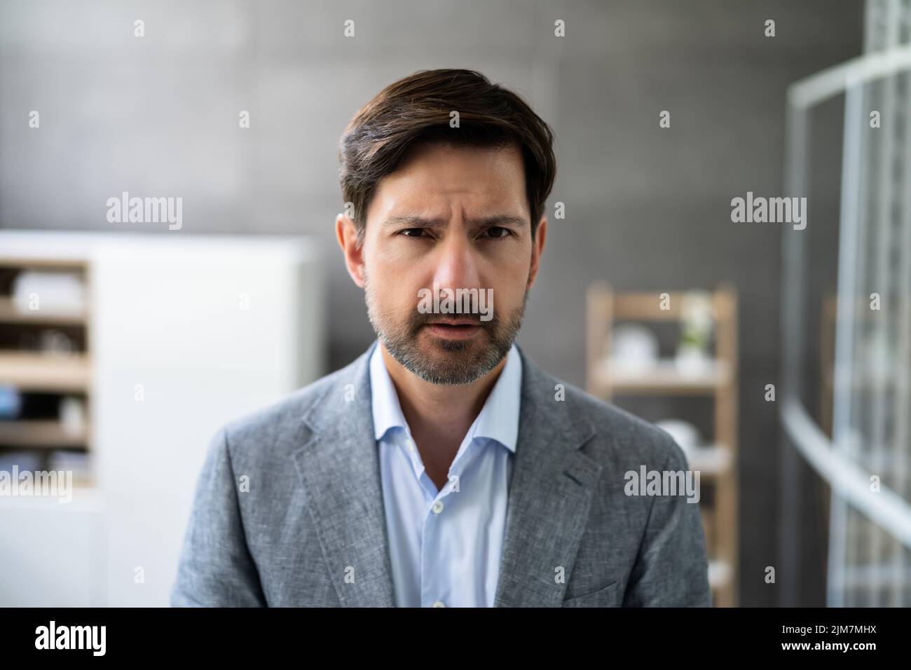 Workplace Quarrel. Angry Looking Man In Video Conference Stock Photo