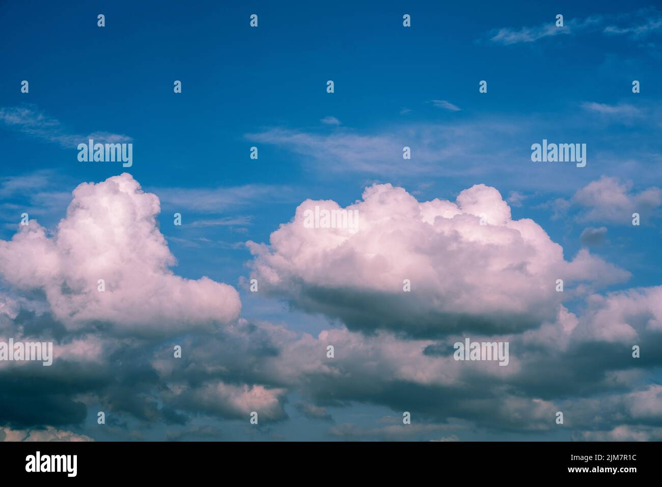 White whispy clouds and blue sky cloudscape. Fluffy white clouds and blue sky. Stock Photo