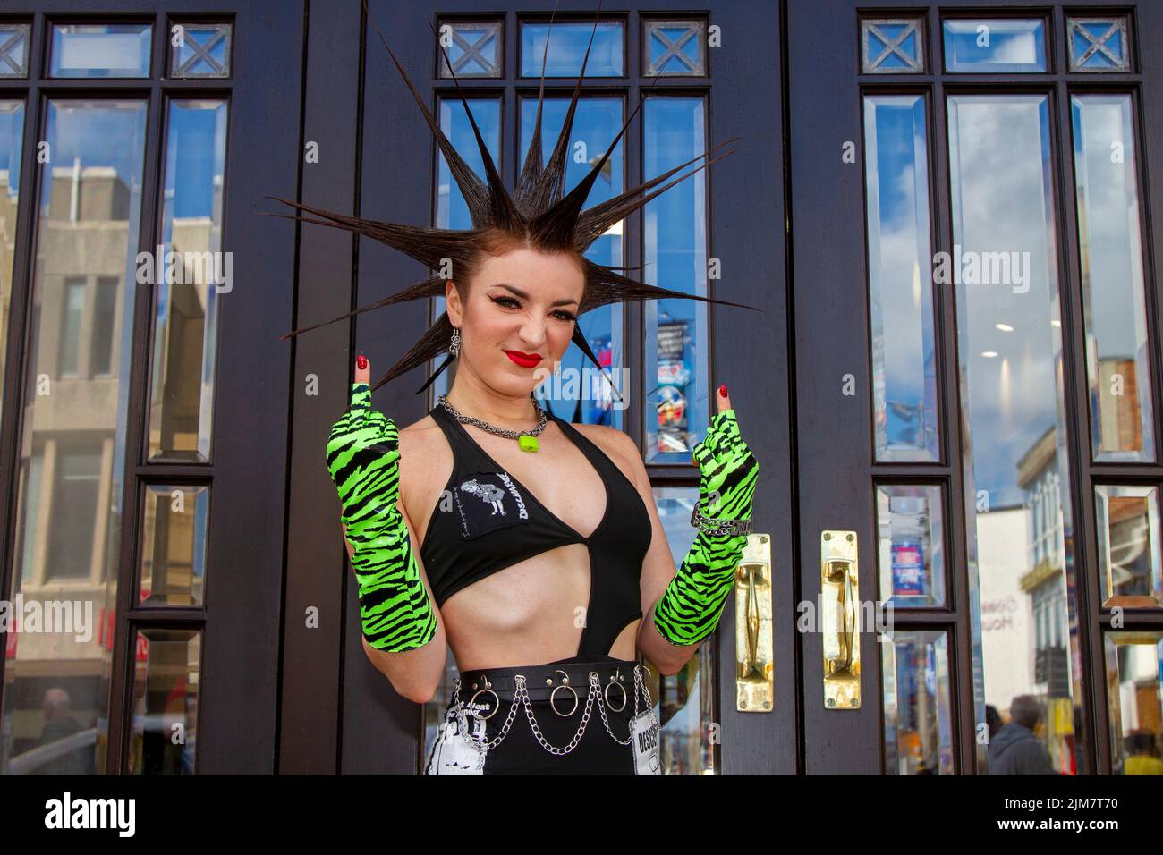 American model, SAG-AFTRA actress, wardrobe stylist, TV host. fashion designer,  with Mohican style, dyed hair and colouring at the Punk Rebellion festival at The Winter Gardens. A protest against conventional attitudes and behaviour, a clash of anti-establishment cultures,  mohawks, safety pins and a load of attitude at the seaside town as punks attending the annual Rebellion rock music festival at the Winter Gardens come shoulder to shoulder with traditional holidaymakers. Stock Photo