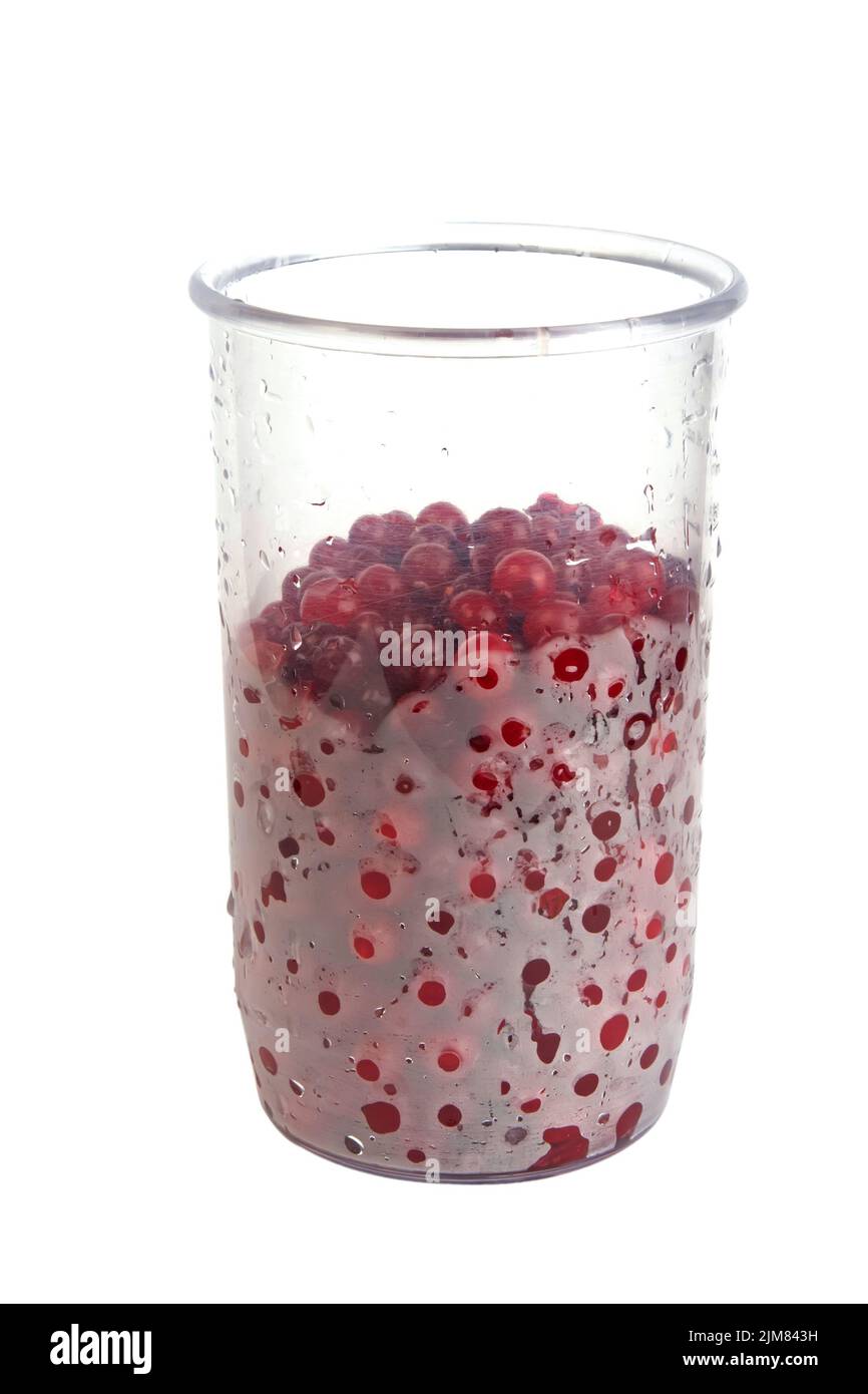 Plastic glass with cranberries Stock Photo
