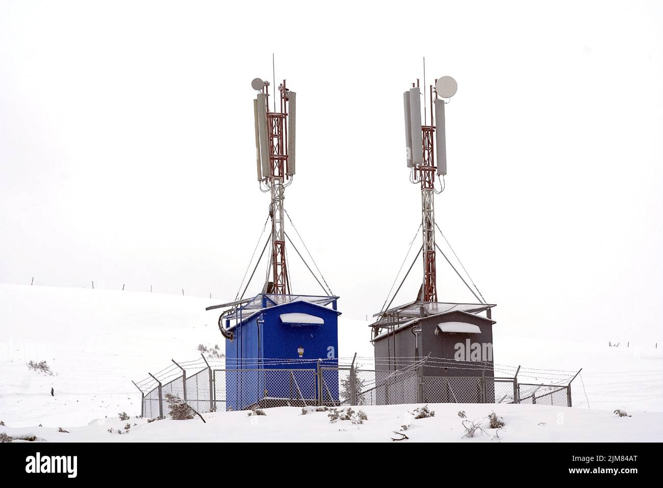 Two GSM towers in winter Stock Photo Alamy