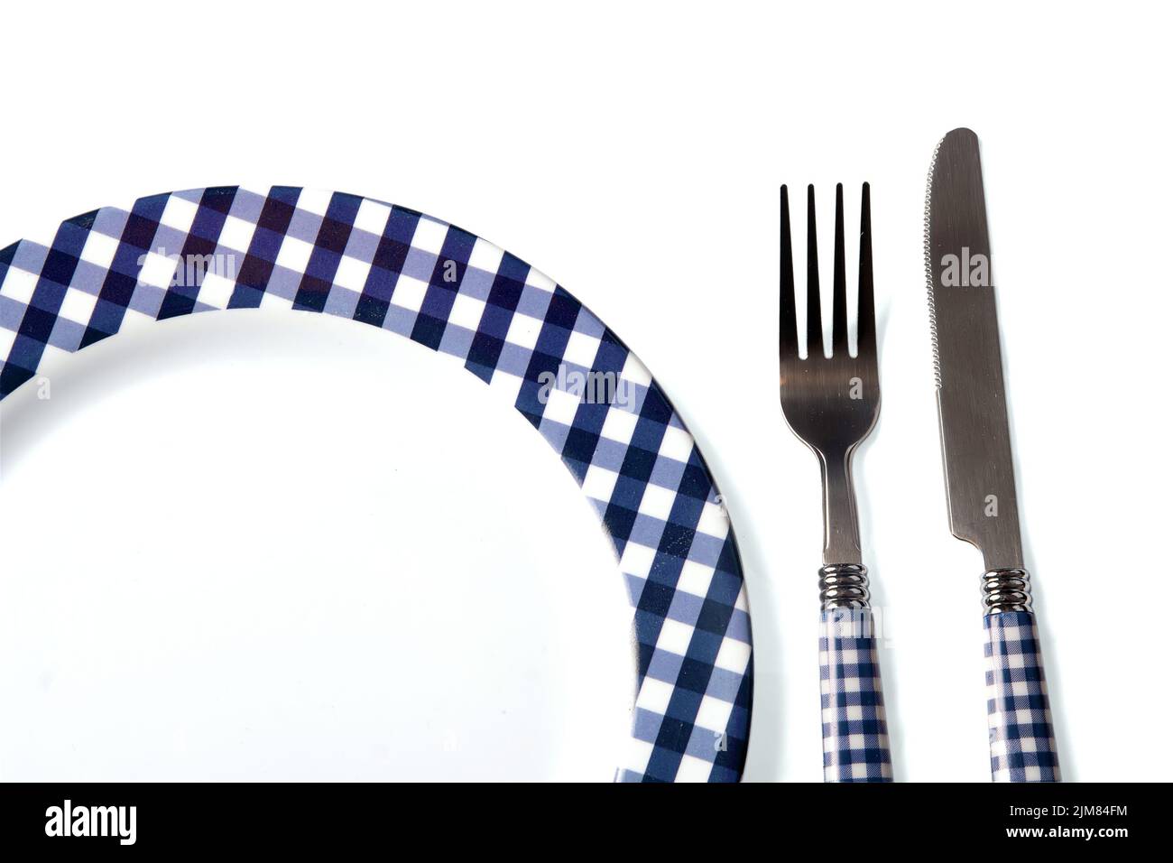 Dinner set (plate, fork, knife) Stock Photo