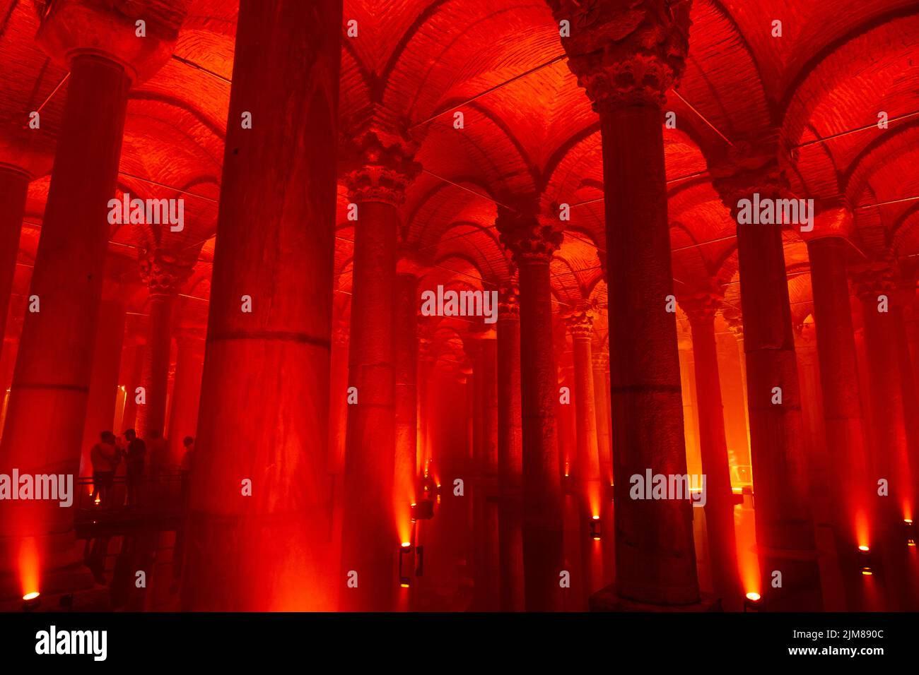 The Basilica Cistern or Yerebatan Sarnici with red ambient lights. Landmarks of Istanbul background photo. Noise and grain included. Selective focus. Stock Photo
