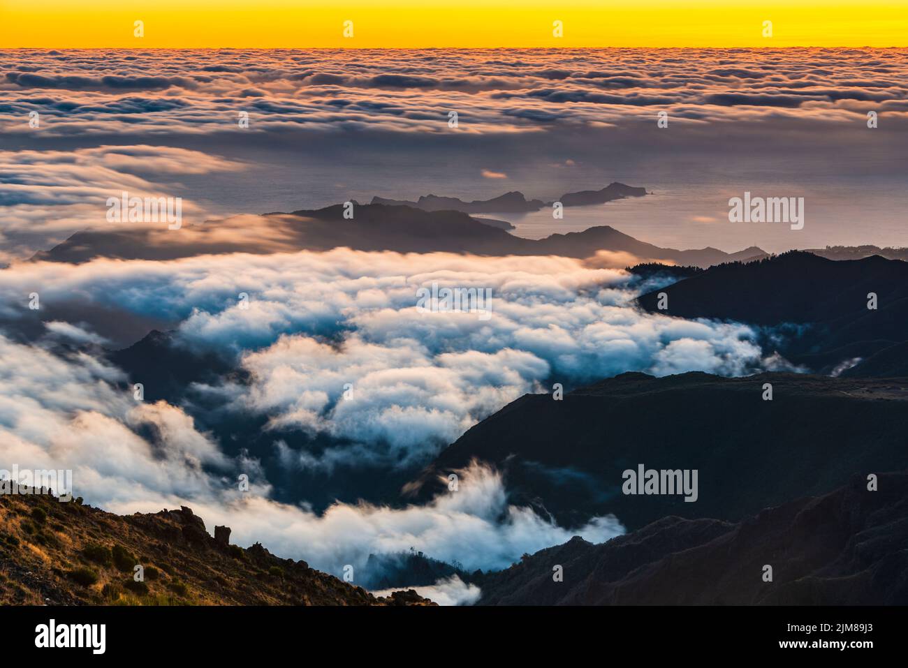 Clouds in the valley at sunrise Stock Photo