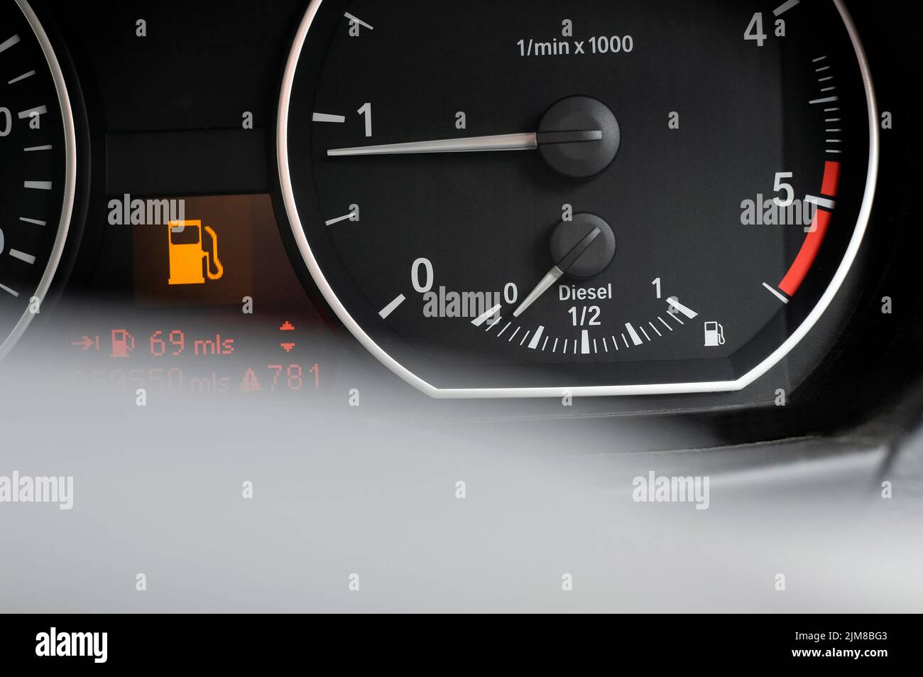 low on diesel fuel gauge in motor vehicle Stock Photo