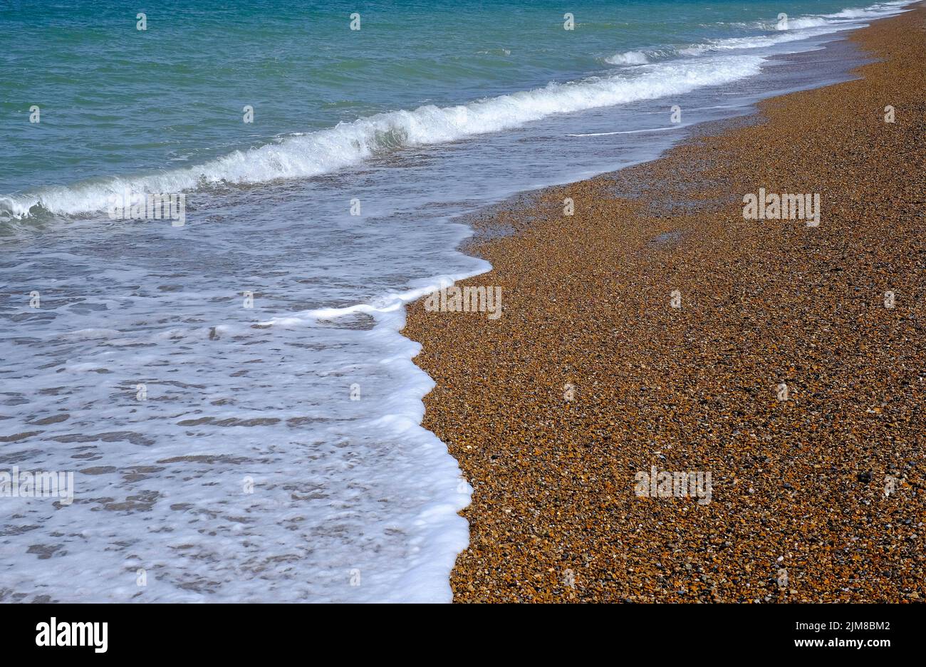 shoreline on shingle beach, cley-next-the-sea, north norfolk, england Stock Photo