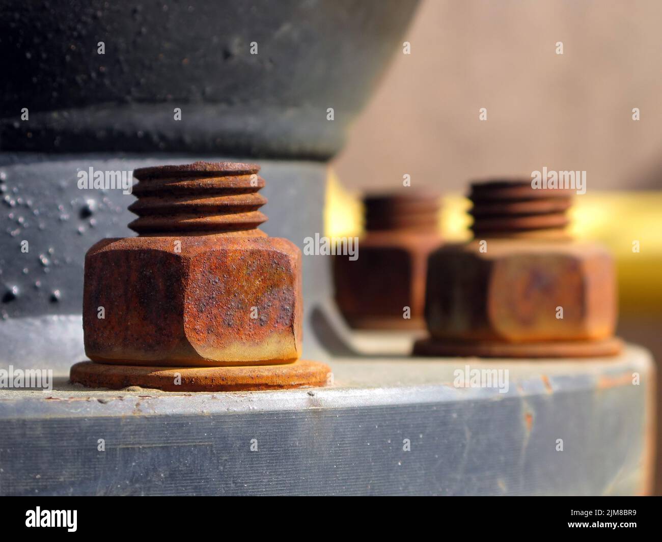Old rusty metal nut on iron water valve Stock Photo
