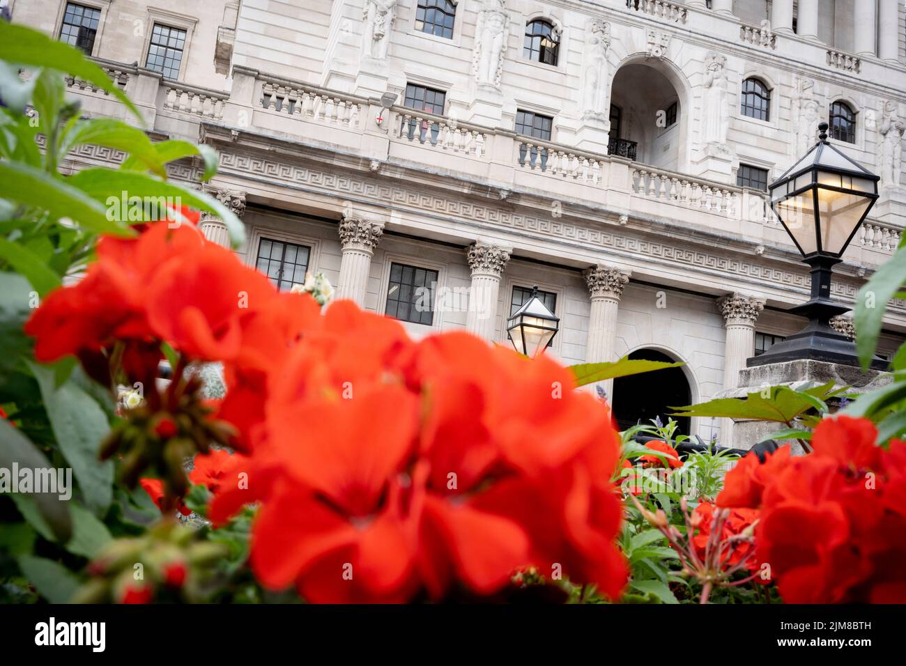 On the day that the Bank of England announced a rise, from 1.25% to 1.75% in the interest rate, the highest increase in 27 years, are flowers and an exterior of the Bank of England, on 4th August 2022, in the City of London, England. This increase is widely seen as a slide towards inflation with a shrinking of the UK economy - the start of its fall into recession in the third financial quarter of 2022. Stock Photo
