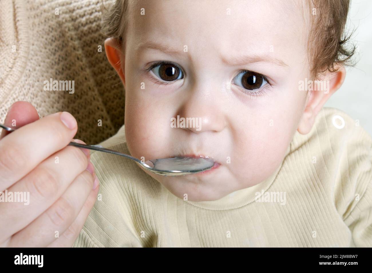 Feeding child Stock Photo