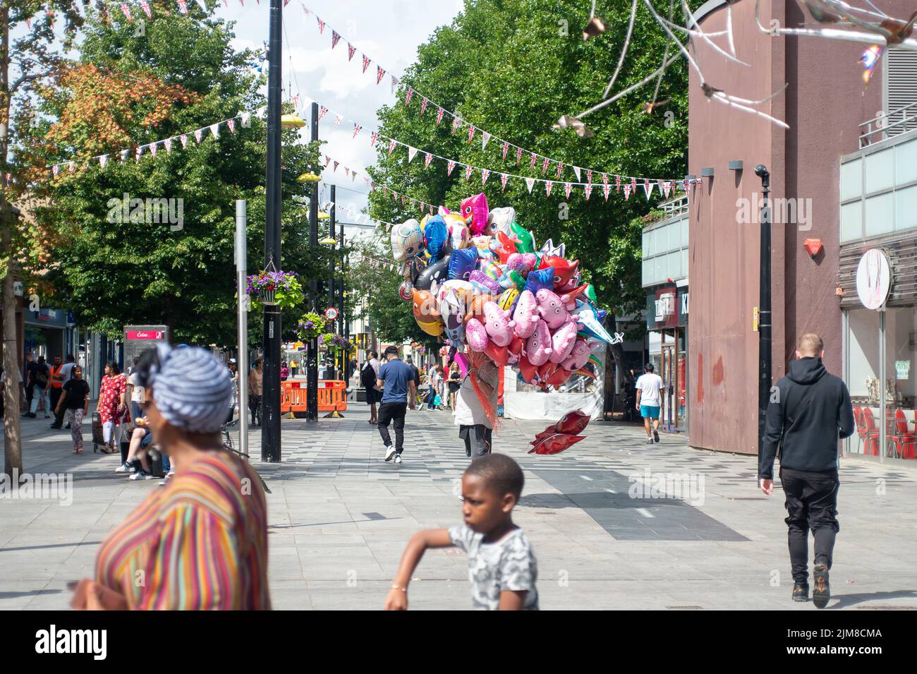 Slough, Berkshire, UK. 4th August, 2022. Shoppers in Slough High Street
