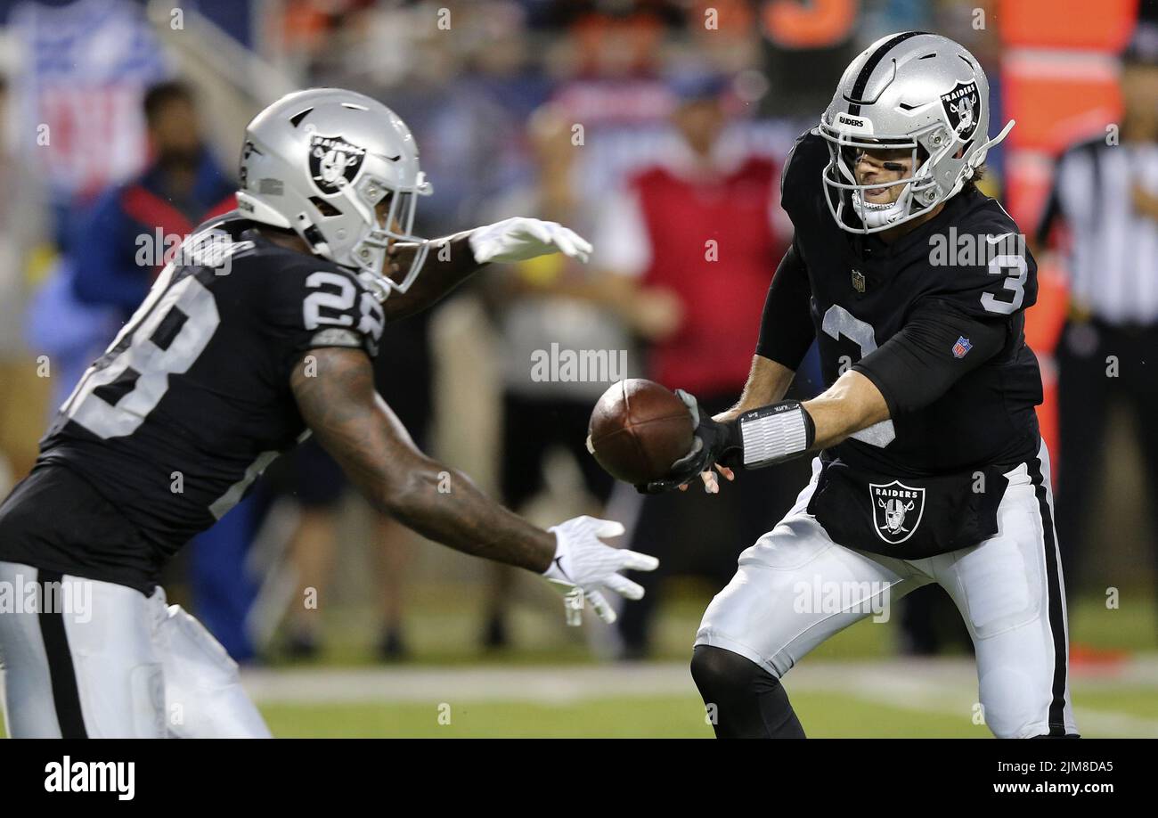 Canton, United States. 04th Aug, 2022. Las Vegas Raiders Jarrett Stidham (3) hands the ball off to Josh Jacobs in the first half of the Pro Football Hall of Game against the Jacksonville Jaguars in Canton, Ohio, on Thursday, August 4, 2022. Photo by Aaron Josefczyk/UPI Credit: UPI/Alamy Live News Stock Photo