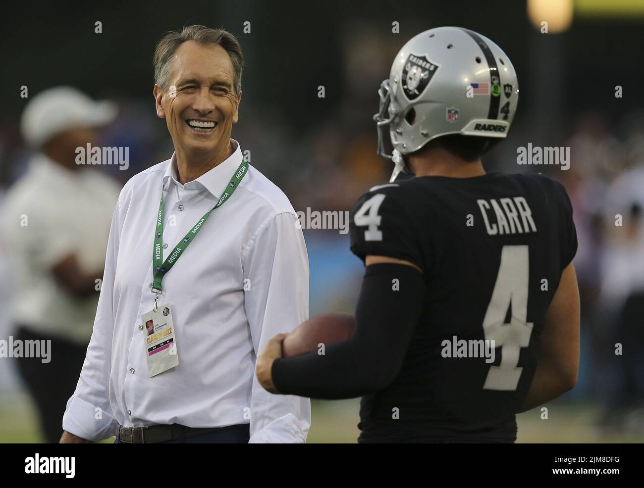 Canton, United States. 04th Aug, 2022. NBC Sportscaster Cris Collinsworth shares a laugh with Las Vegas Raiders quarterback Derek Carr (4) prior to the start of the Pro Football Hall of Game against the Jacksonville Jaguars in Canton, Ohio, on Thursday, August 4, 2022. Photo by Aaron Josefczyk/UPI Credit: UPI/Alamy Live News Stock Photo