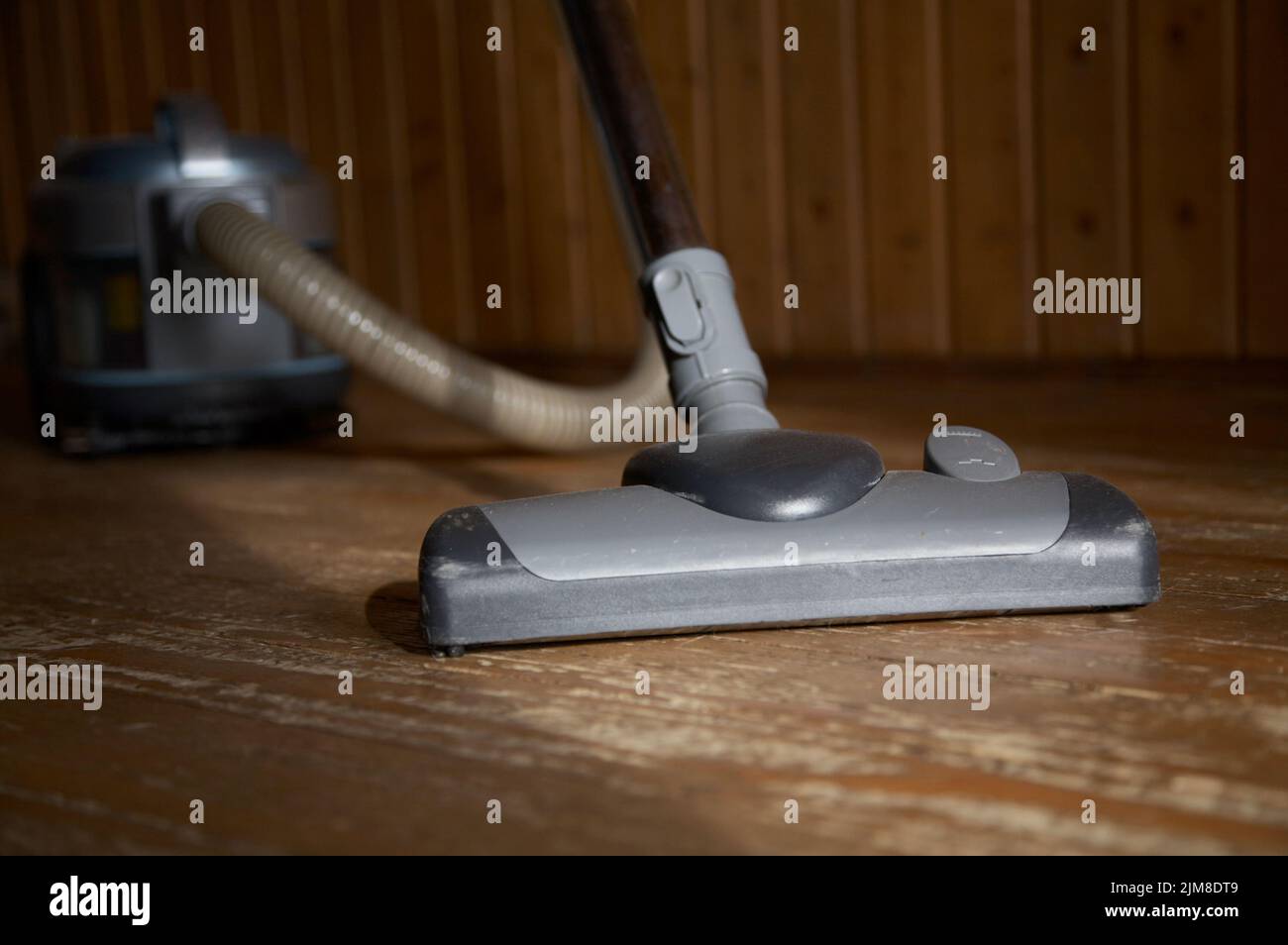 The vacuum cleaner cleans floor Stock Photo Alamy The vacuum cleaner cleans floor Stock Photo Alamy