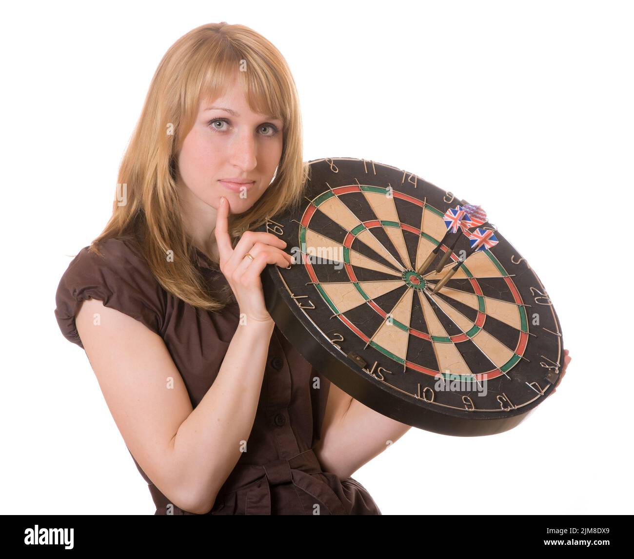The girl holds target with arrows of a darts Stock Photo
