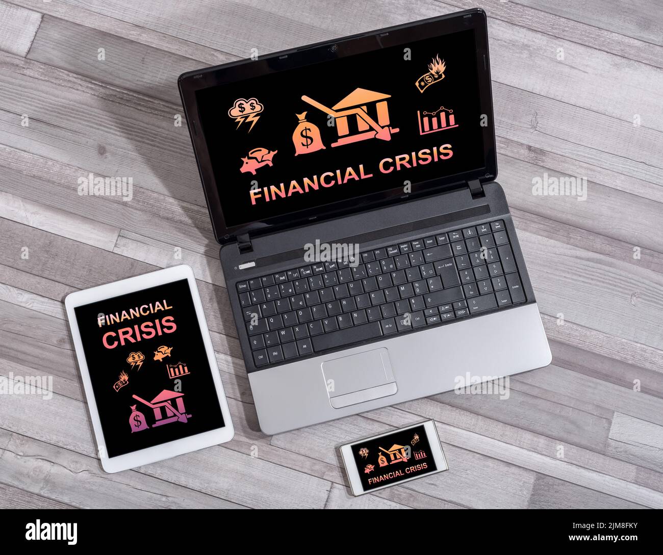 Financial crisis concept shown on different information technology ...