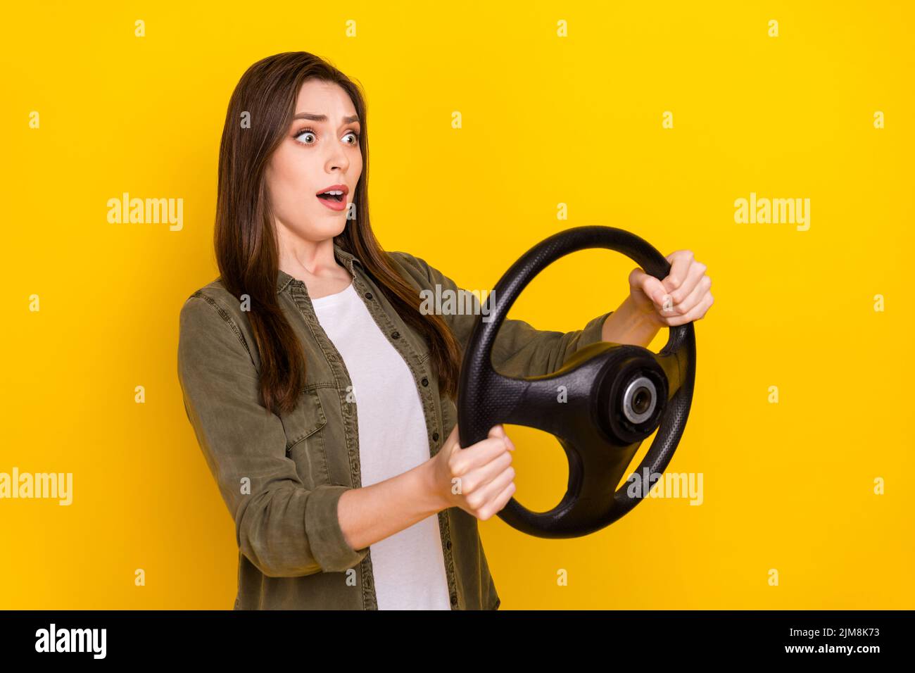 Photo of impressed lady riding superfast practice to ride automobile traveling around country isolated on yellow color background Stock Photo