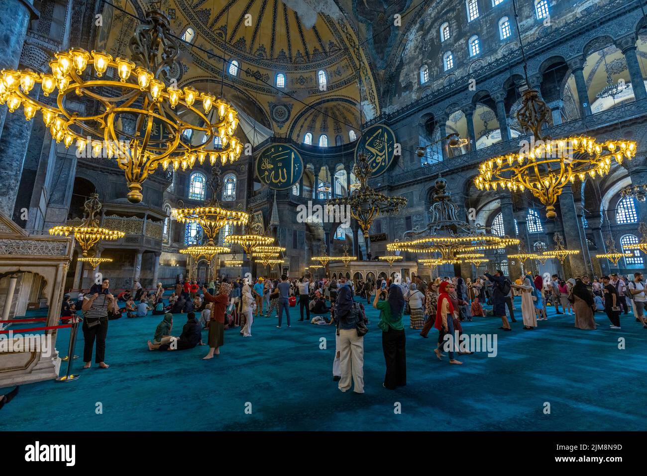 ISTANBUL/TURKEY - July 7, 2022: tourists visit the hagia sophia mosque Stock Photo