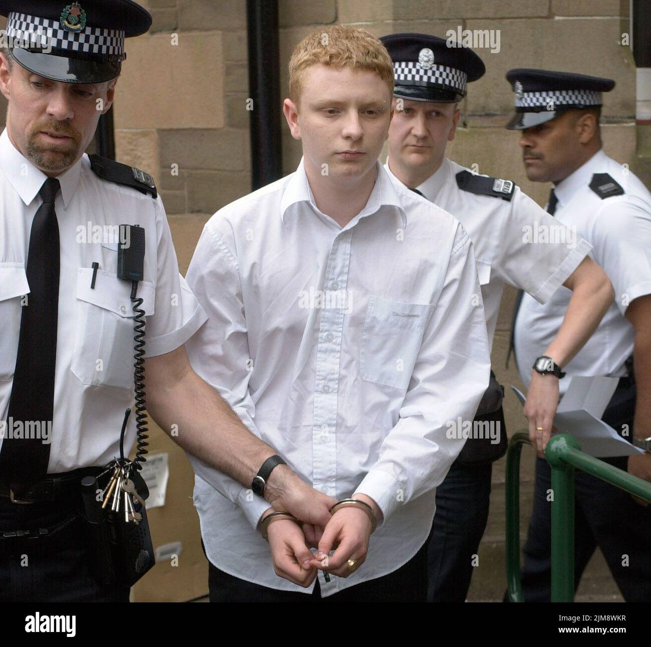 File photo dated 17/04/02 of Robbie McIntosh, 16, being led away from Forfar Sheriff Court, Forfar, after he was found guilty of stabbing 34-year-old Anne Nicoll to death as she walked her dog in Law Hill, Dundee. Linda McDonald, who was battered with a dumbbell by the murderer who was out on home leave, has said she 'doesn't even feel angry' towards her attacker. Ms McDonald has ssaid she forgives Robbie McIntosh for assaulting her as she walked her dog in Dundee's Templeton Wood in August 2017. Issue date: Friday August 5, 2022. Stock Photo