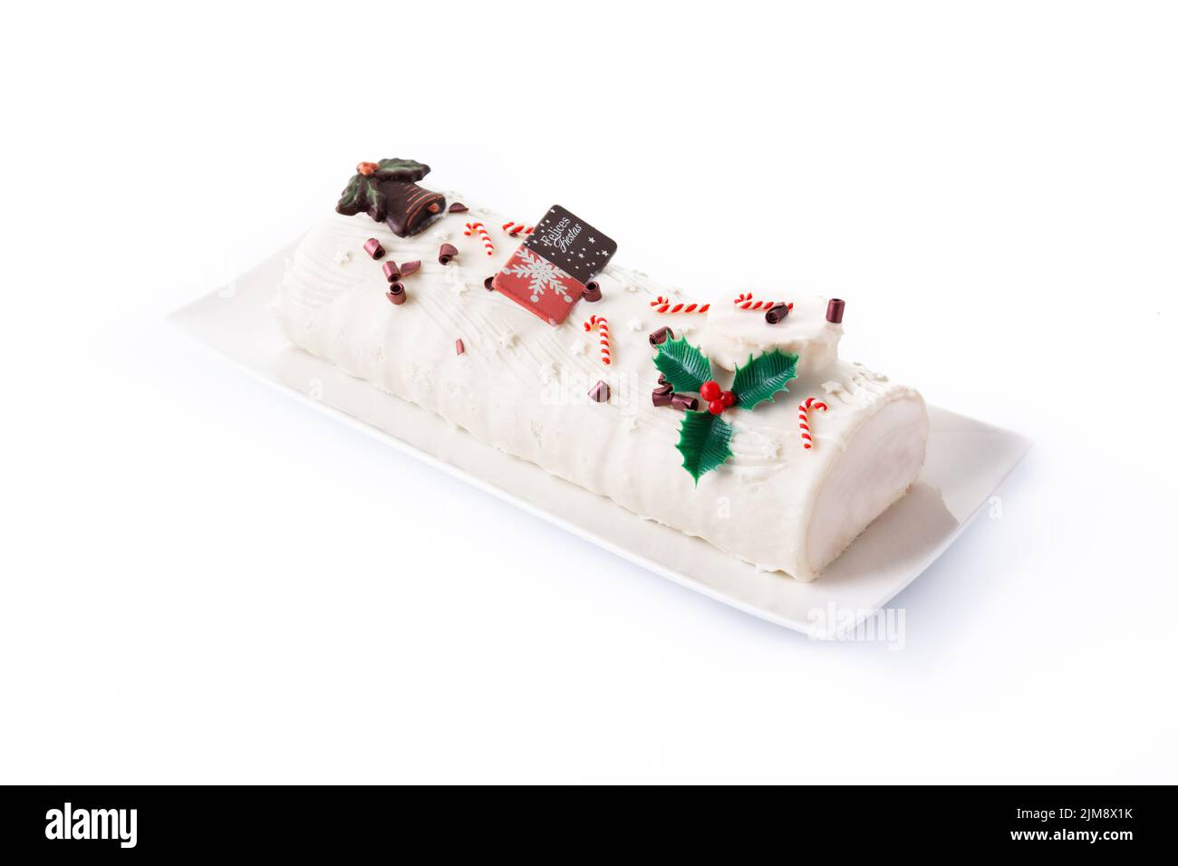 White chocolate yule log cake isolated on white background Stock Photo