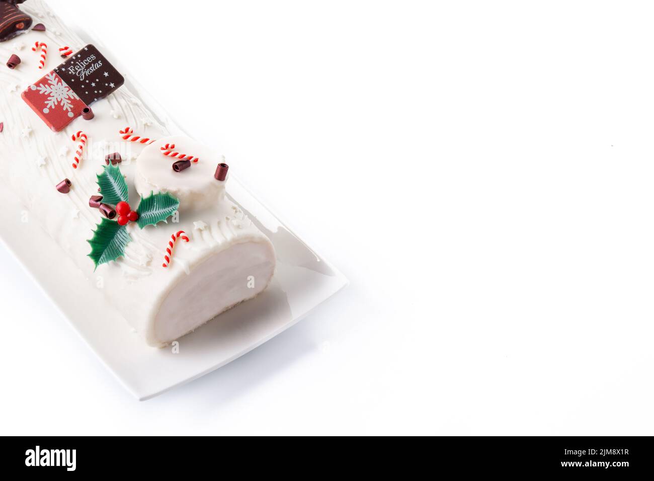White chocolate yule log cake isolated on white background Stock Photo