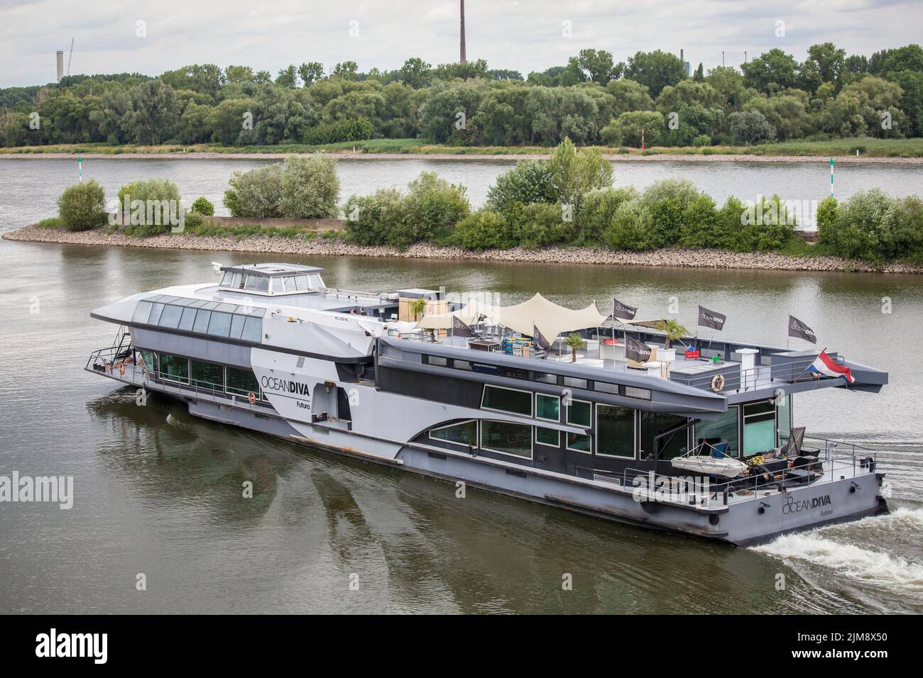 the event ship OceanDiva Futura leaving the Rhine harbor Niehl, Cologne, Germany.  das Eventschiff OceanDiva Futura bei der Ausfahrt aus dem Niehler H Stock Photo