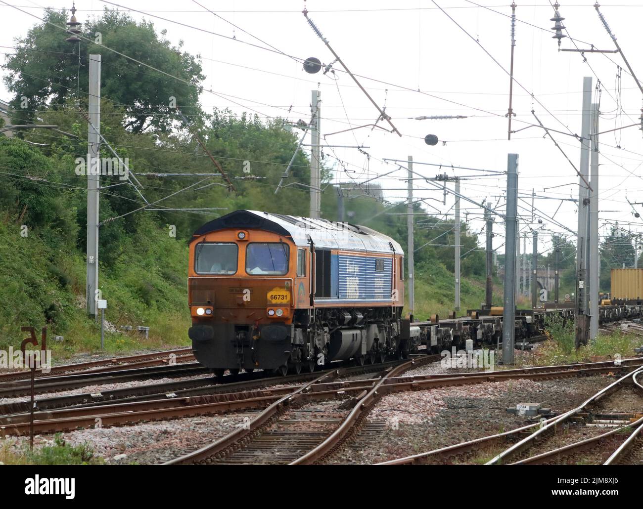 GB Railfreight class 66 66731 named Capt Tom Moore A True British Inspiration, with legend Thank you NHS on WCML at Carnforth on 3rd August 2022. Stock Photo