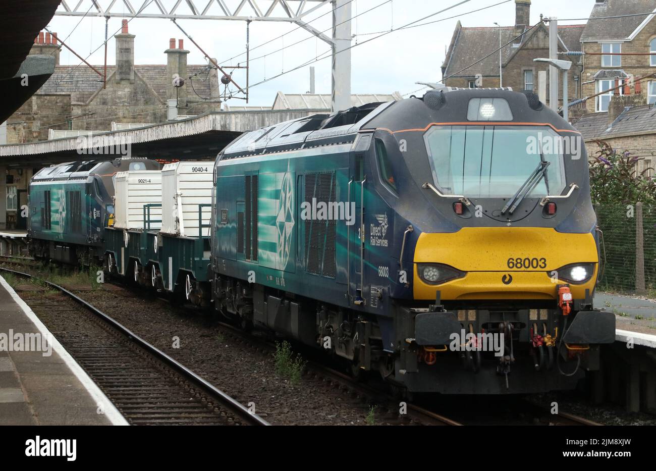 Direct Rail Services class 68 UK Light diesel-electric locos 68003 Astute and 68004 Rapid, wait at Carnforth with nuclear flask train 3rd August 2022. Stock Photo