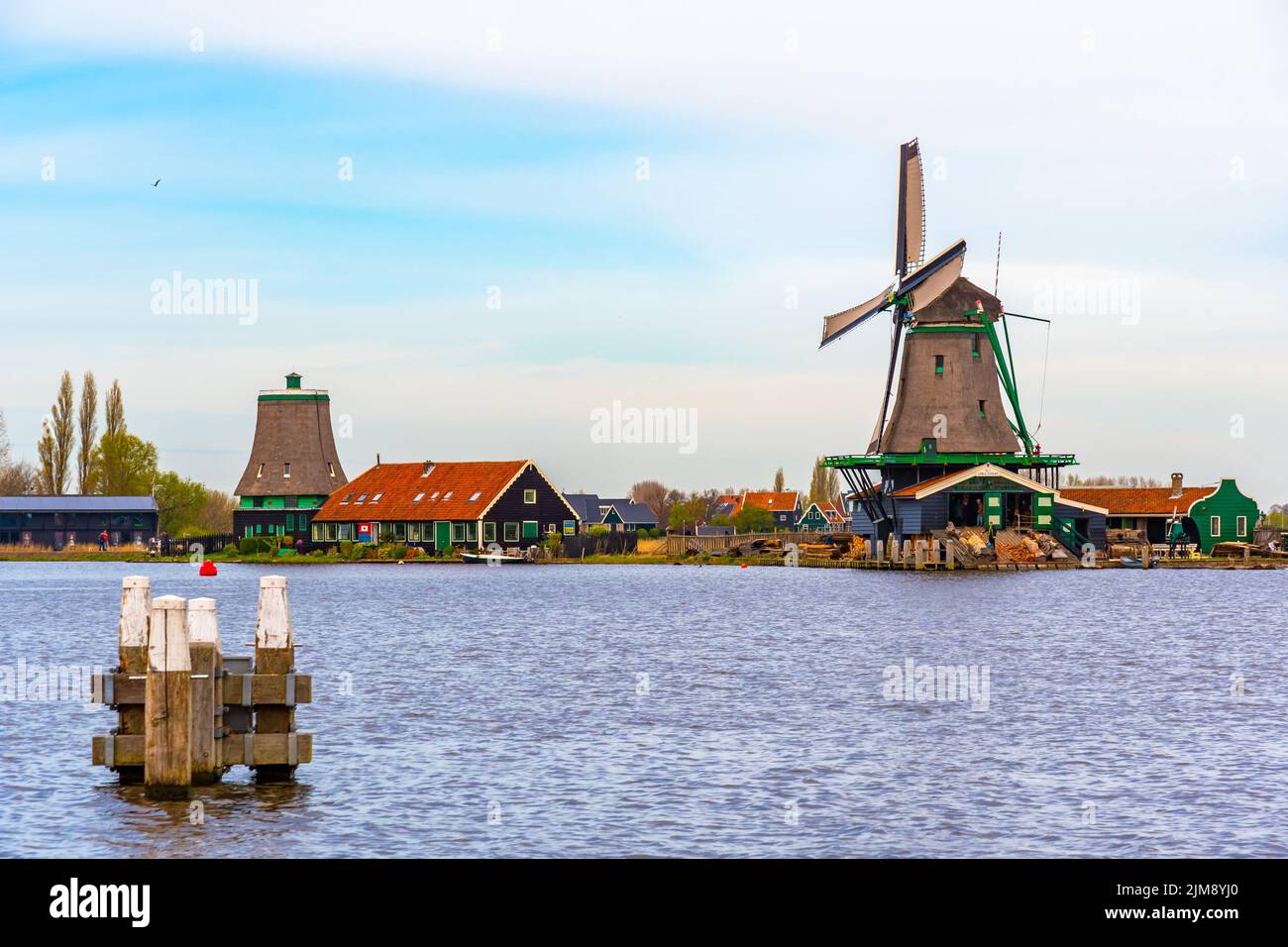 Traditional windmills over at the Zaanse Schans, cloudy weather Stock Photo