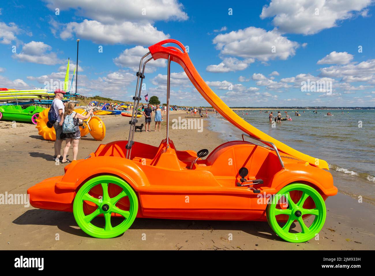 Studland, Dorset UK. 5th August 2022. UK weather: warm and sunny at Knoll beach, Studland beaches as sunseekers head to the seaside to enjoy the sunshine. The new sea cars with slide proves to be a popular attraction. Credit: Carolyn Jenkins/Alamy Live News Stock Photo
