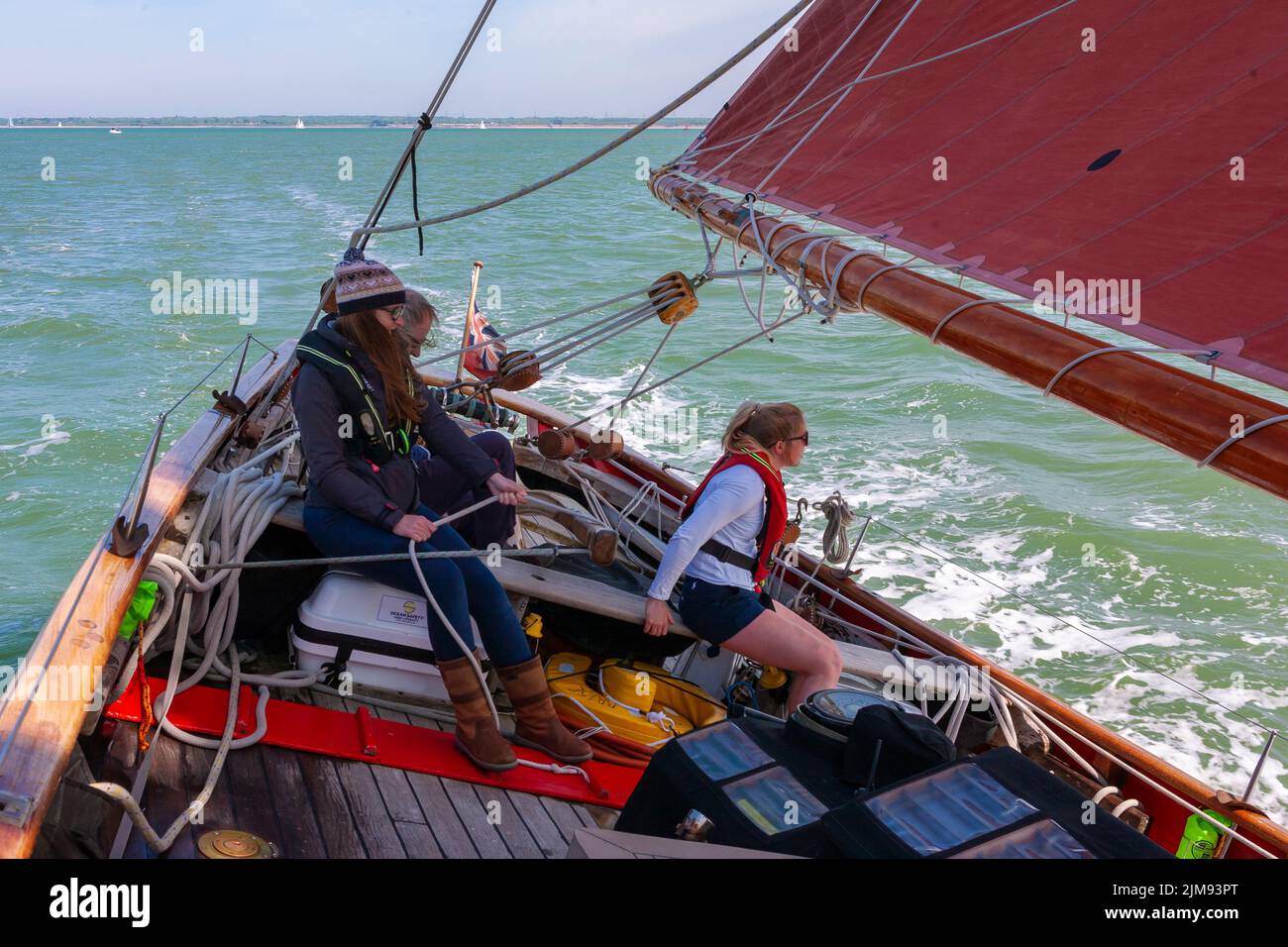 Sailing aboard the traditional gaff cutter 'Jolie Brise': Solent, Hampshire, UK Stock Photo