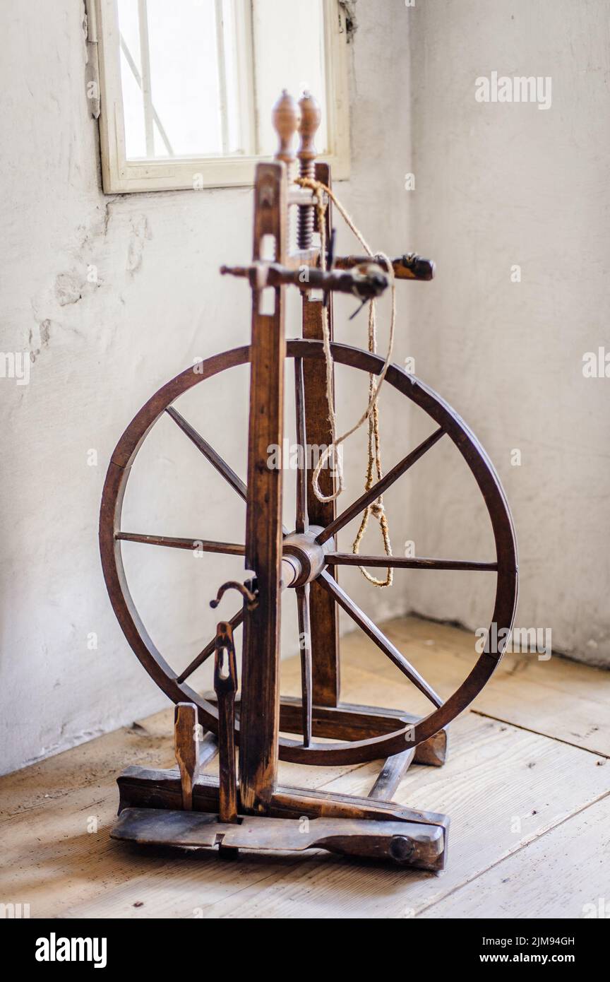 Old spinning wheel Stock Photo Alamy