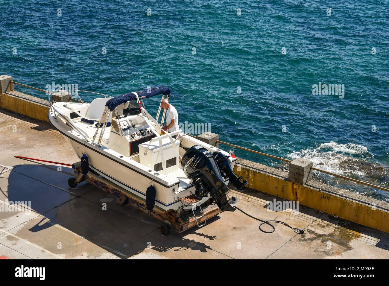 Man on motorboat hi-res stock photography and images - Alamy