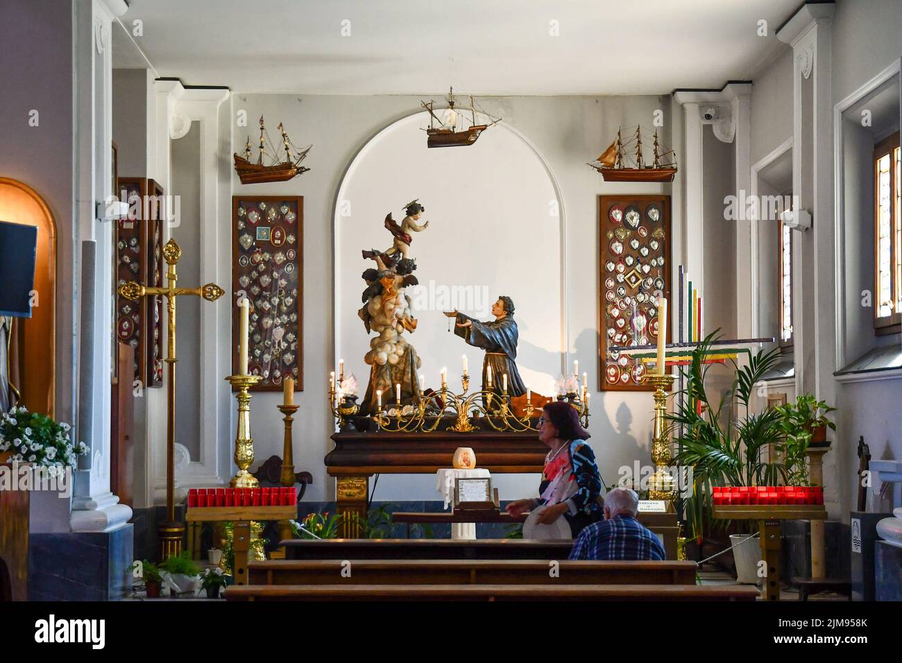 Interior of the church of St Anthony with statues and ex-voto in the fishing village of Boccadasse, Genoa, Liguria, Italy Stock Photo