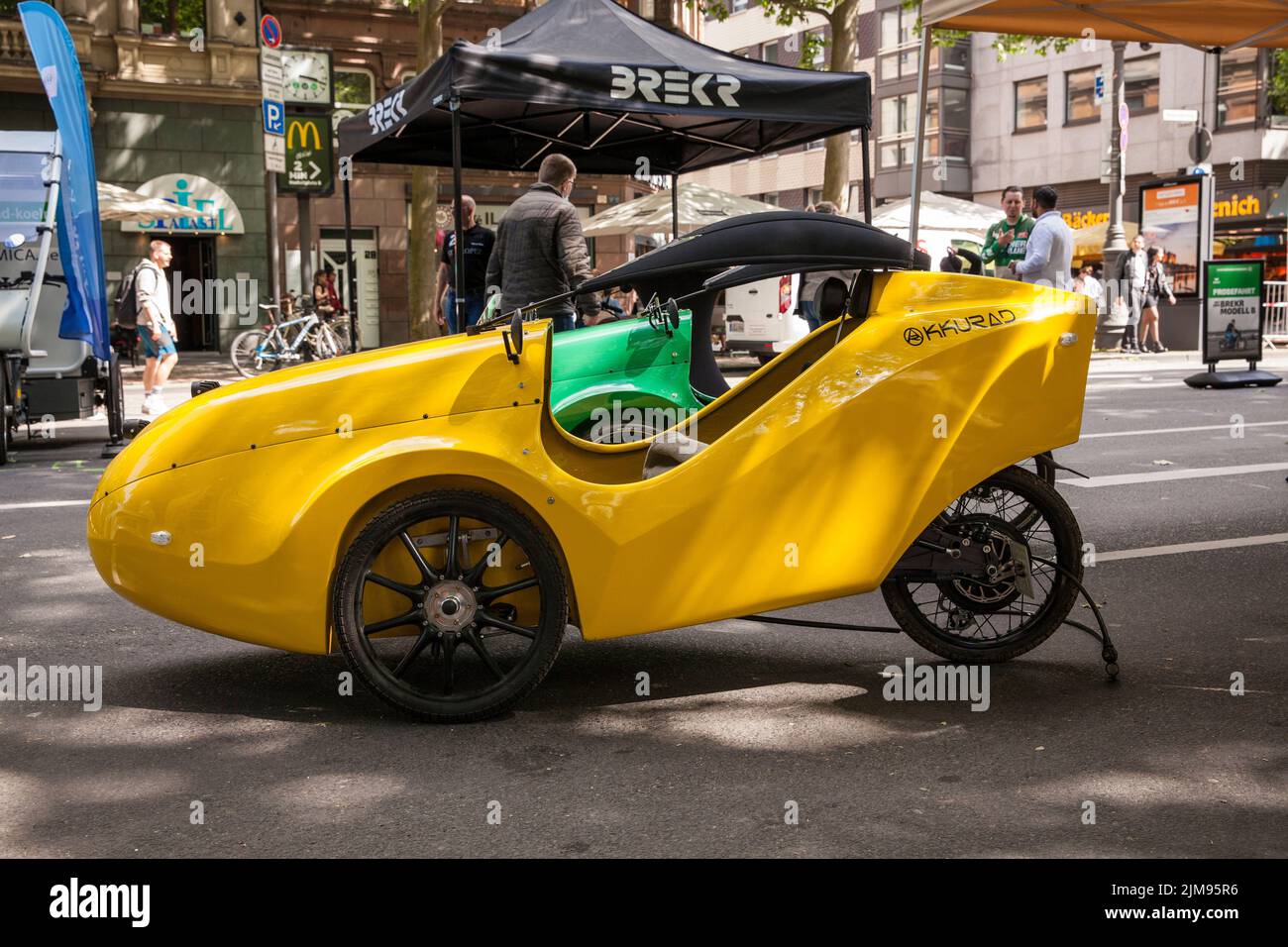 at the polisMobility Moving Cities fair exhibitors present different mobility concepts for the future, Cologne, Germany. Velomobile of the company Akk Stock Photo