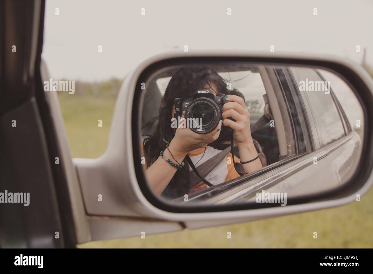 photographer in car mirror Stock Photo