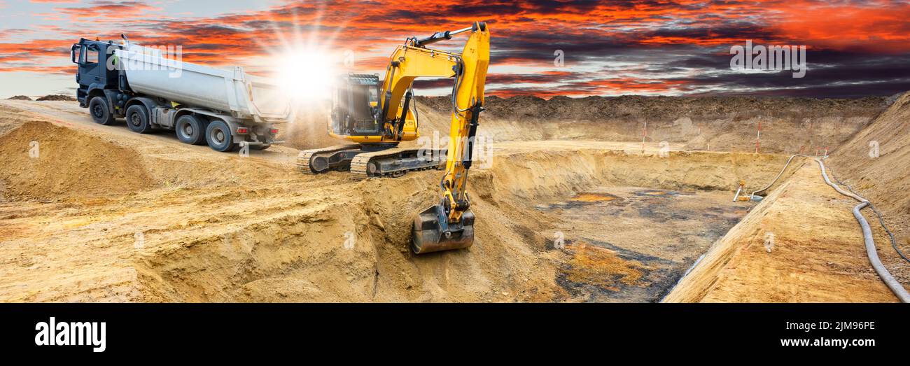excavator is digging on construction site Stock Photo