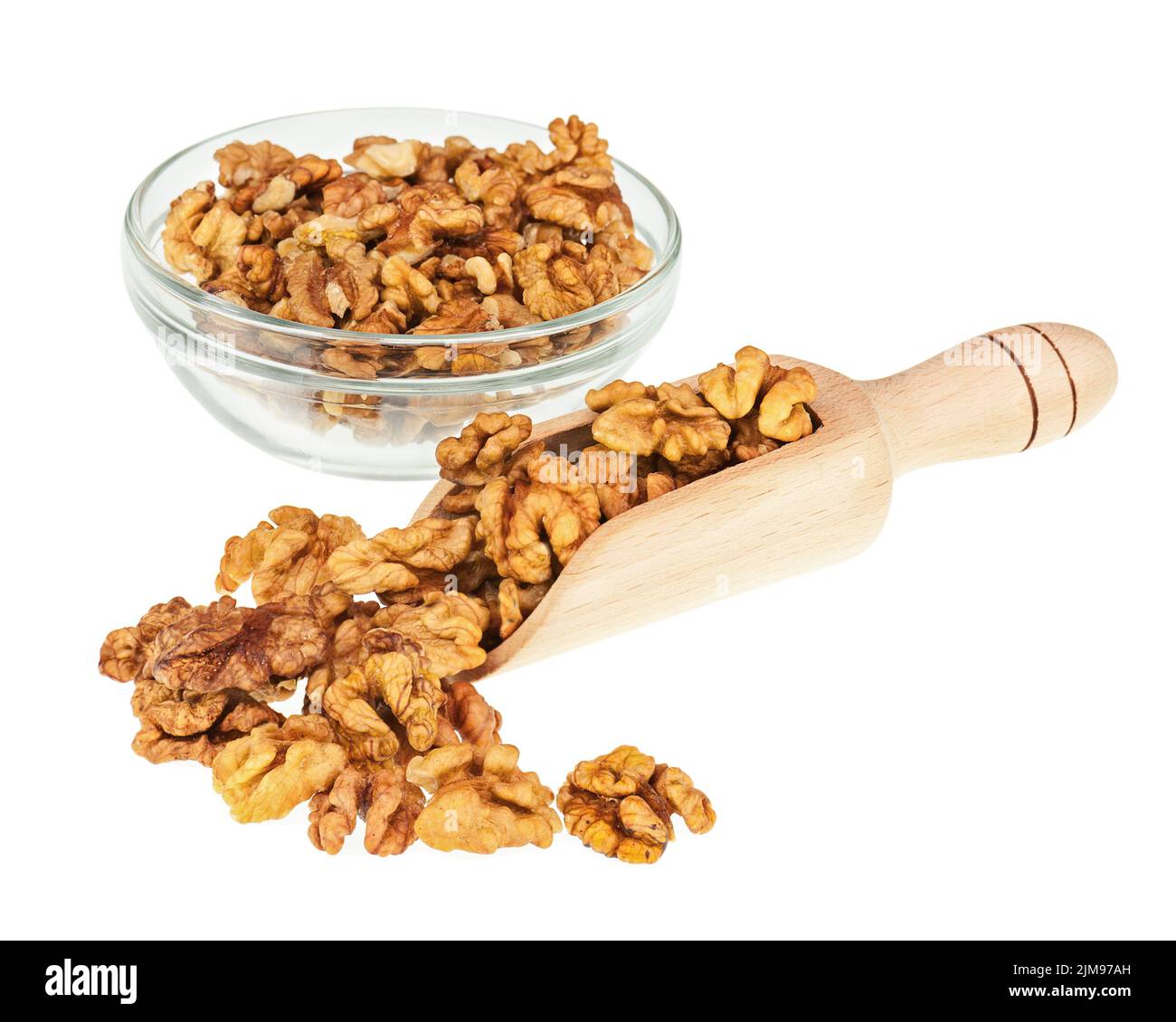 Handful of walnuts in scoop and glass bowl isolated on white Stock ...