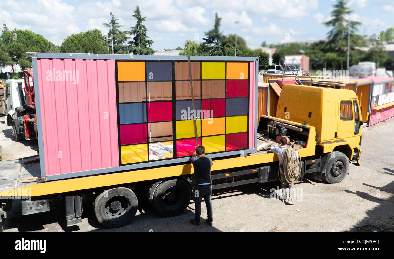 Process of loading truck trailer via crane. Selective focus included Stock Photo