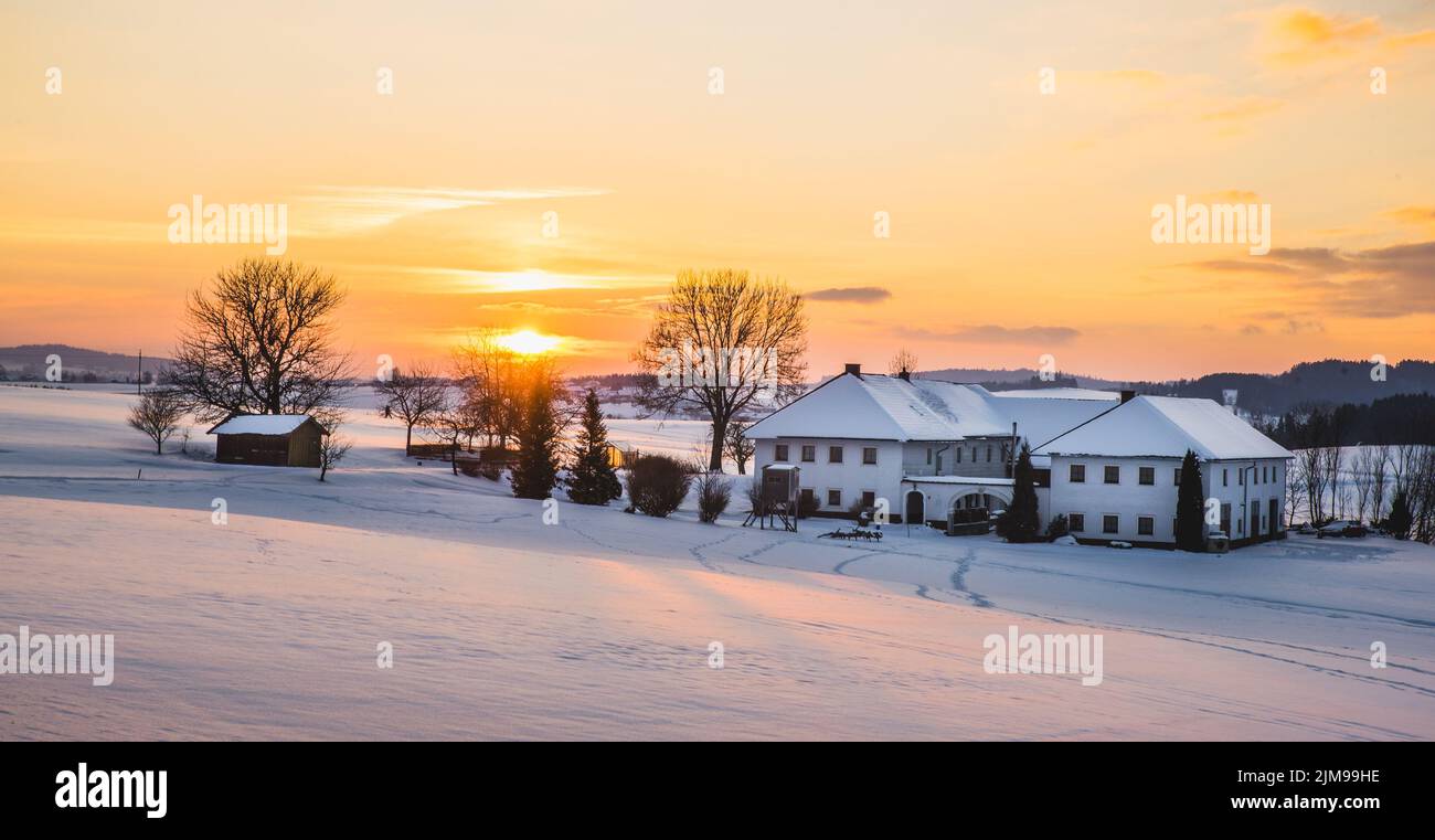 Farmhouse in a winter landscape at sunrise Stock Photo - Alamy