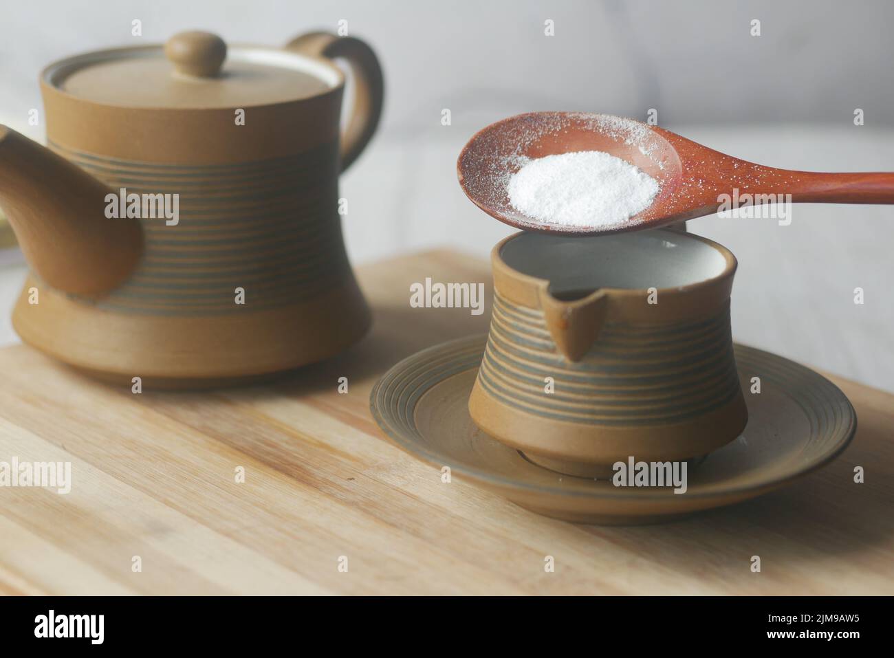 putting Sugar Substitute sweetener in a tea cup Stock Photo Alamy