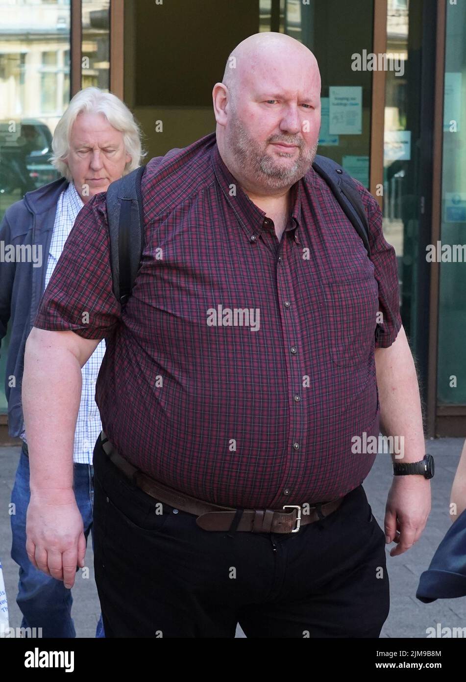 Former church official Martin Sargeant (front), 52 , of Dudley, in the West Midlands, leaves Westminster Magistrates' Court, London, where he appeared charged with fraud and money laundering approximately £5.2 million from the Church of England's Diocese of London. Picture date: Friday August 5, 2022. Stock Photo