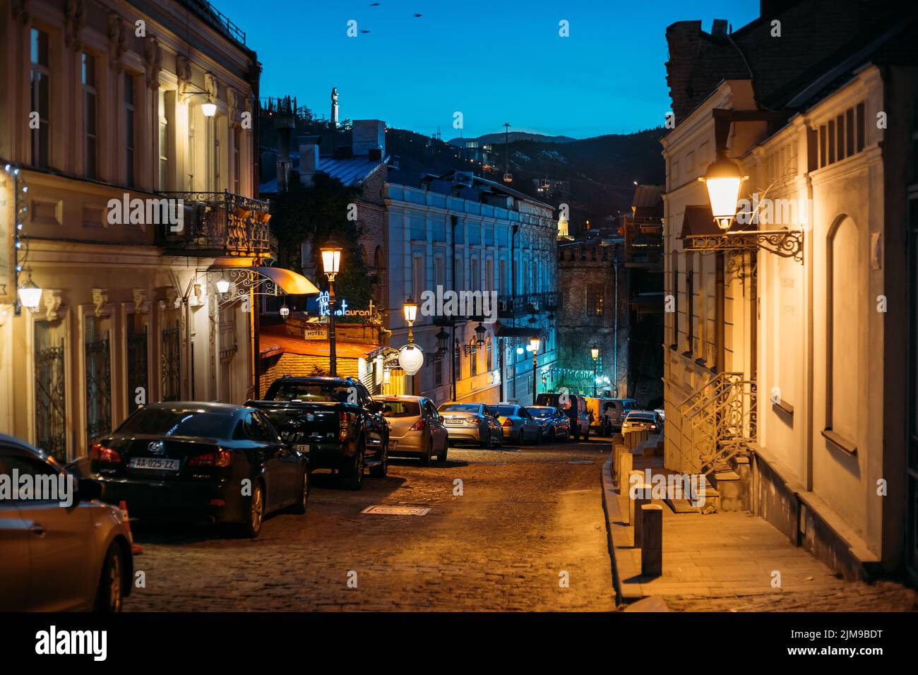Tbilisi, Georgia - March 28, 2022: Parked Cars In A Row On A Victor Djorbenadze Street In Tbilisi. Night View Of City Streets Of Tbilisi Stock Photo