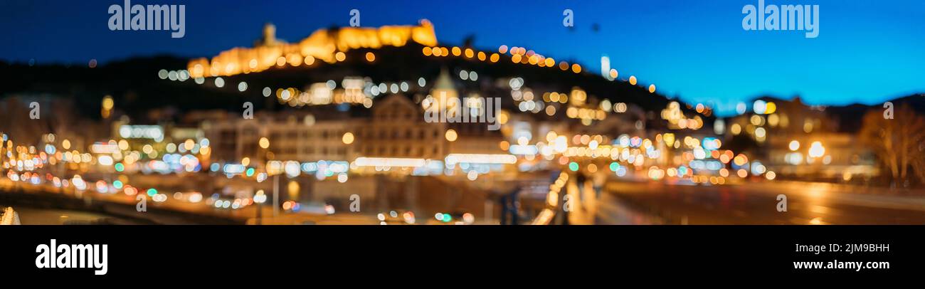 Night Boke Bokeh Blurred Ancient Fortress Narikala In Old Town Of Tbilisi. Caucasus. Tbilisi, Georgia Scenic Panoramic View Of Impregnable Fortress Stock Photo