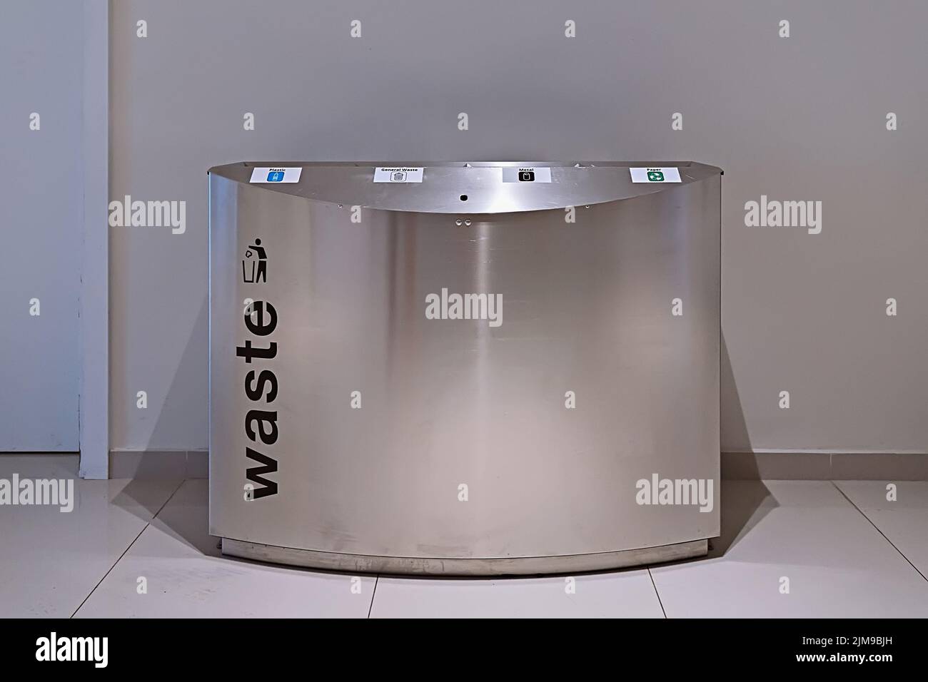 Modern steel litter bin with sections for sorting rubbish in public