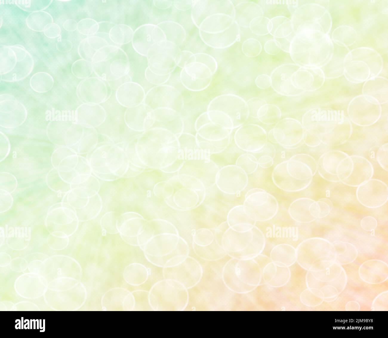 Abstract Boken Background in Light Yellow, Orange and Green Shades. Stock Photo