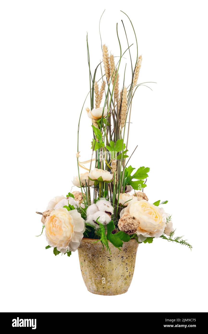 Bouquet from peony flowers, cotton balls and ears of wheat. Stock Photo