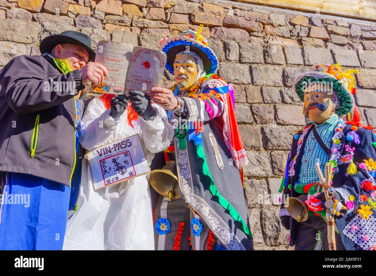 Valfloriana, Italy - February 26, 2022: Youth born in 2004 celebrate reaching legal drinking age (wine pass), in the Valfloriana 2022 carnival, Trenti Stock Photo