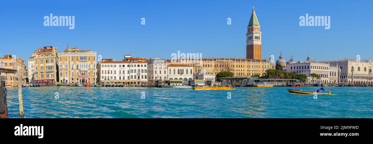 Venice, Italy - March 01, 2022: Panoramic view of the St, Marks waterfront, with boats, locals and visitors, in Venice, Veneto, Northern Italy Stock Photo