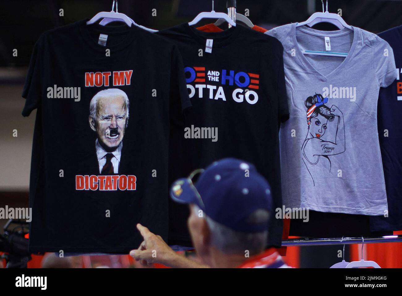 A t-shirt depicting U.S. President Joe Biden as Adolf Hitler is displayed for sale at the Conservative Political Action Conference (CPAC) in Dallas, Texas, U.S., August 4, 2022.  REUTERS/Brian Snyder Stock Photo